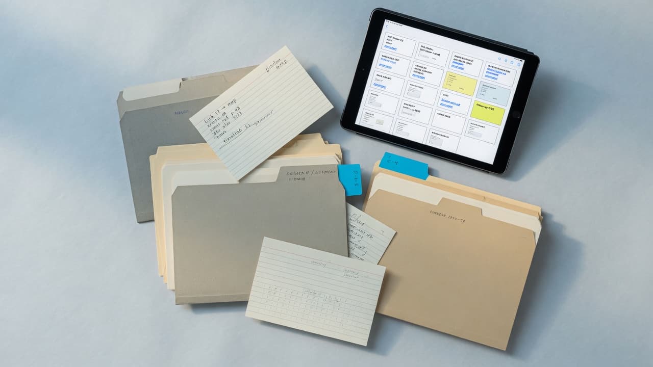 Nested folders, index cards, and a tablet grid of saved material